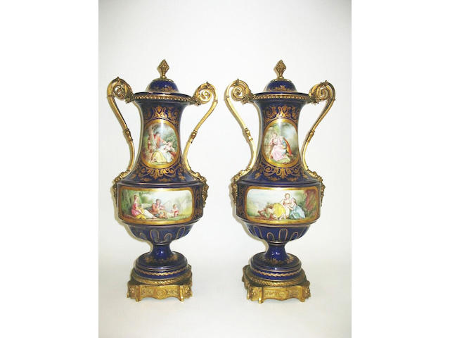 A pair of Sevres style vases and covers