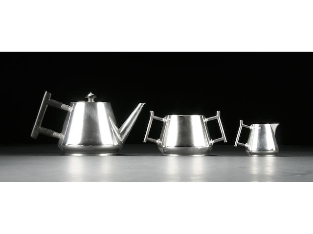 Christopher Dresser for Hukin and Heath. A three piece silver tea service, London 1880,
