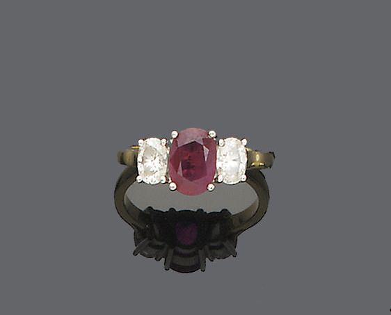 A ruby and diamond three-stone ring