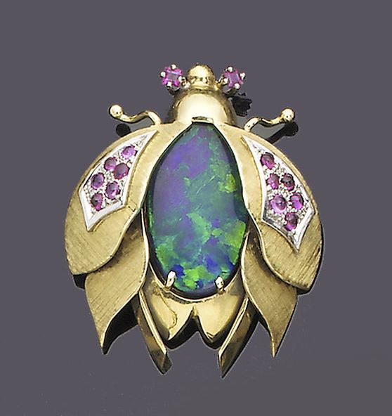 An opal doublet and ruby bee brooch