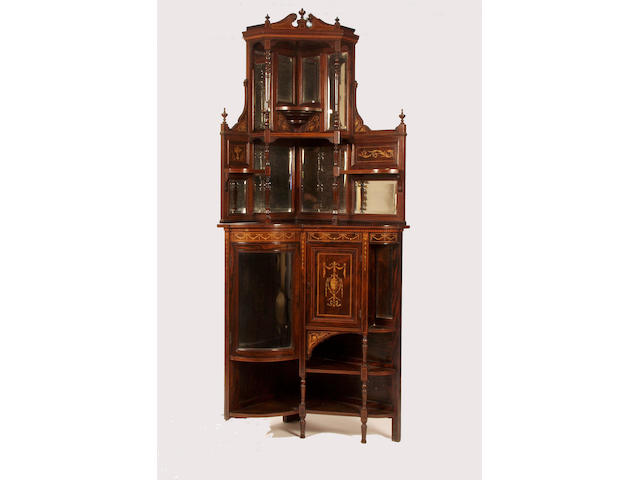 A late Victorian rosewood and inlaid floor standing corner cabinet