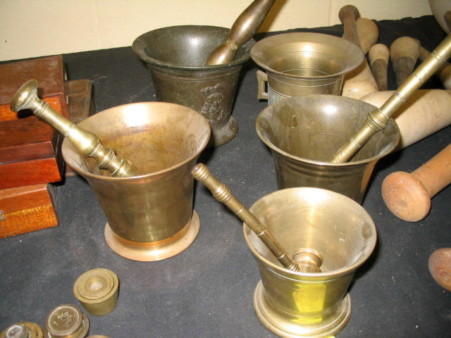 A gun metal pestle and mortar, and others