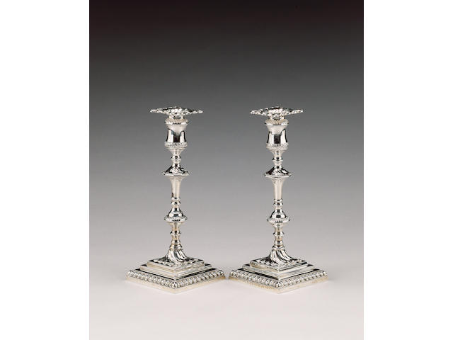 A pair of silver candlesticks in the George III style, by T. Bradbury, London 1918,
