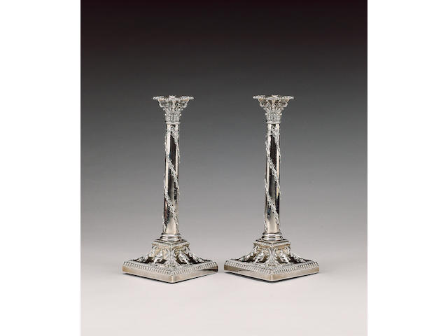 An Edwardian pair of silver candlesticks, by T. Bradbury, London 1904,
