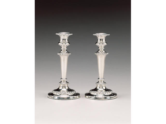 A George III pair of silver candlesticks, by John & Thomas Settle, Sheffield 1817 and 1818,