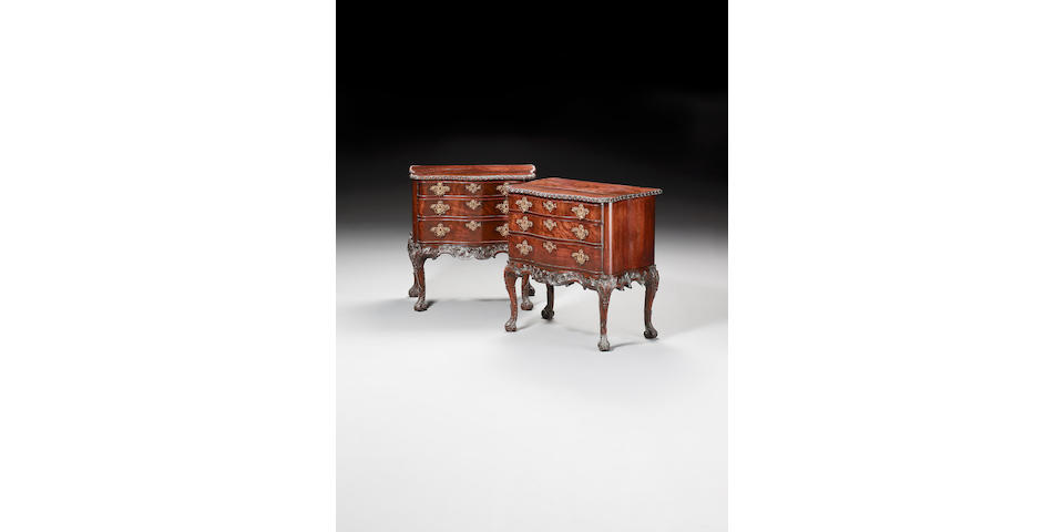 A pair of George II carved mahogany serpentine Commodes,possibly attributable to Thomas Chippendale