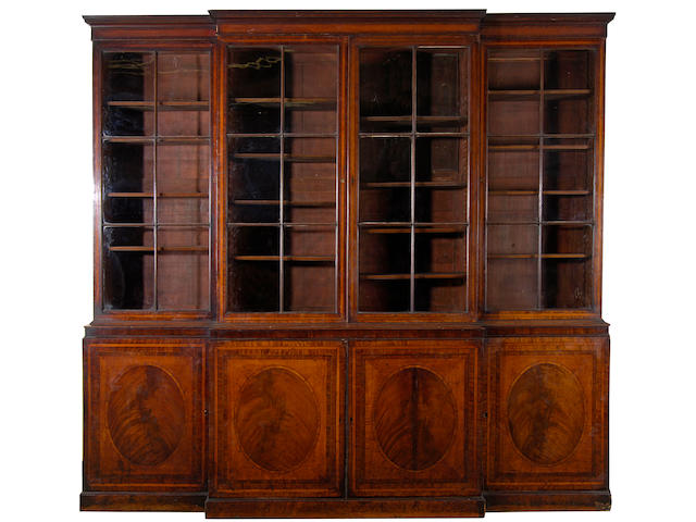 A George III mahogany and satinwood breakfront library bookcase