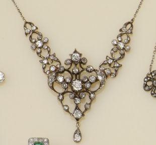 A late Victorian gold and silver mounted diamond pendant necklace