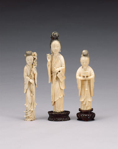 Three stained ivory figures,