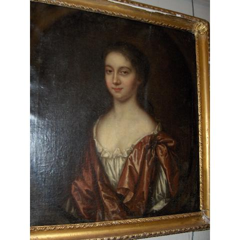 British School (circa 1700) A portrait of a lady, waist length, wearing a red cloak 64 x 77cm.