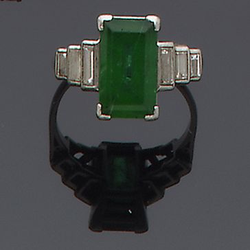 An emerald and diamond ring
