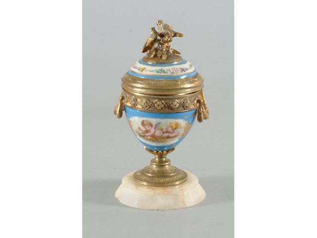A late 19th Century Sevres style porcelain and gilt brass mounted inkwell
