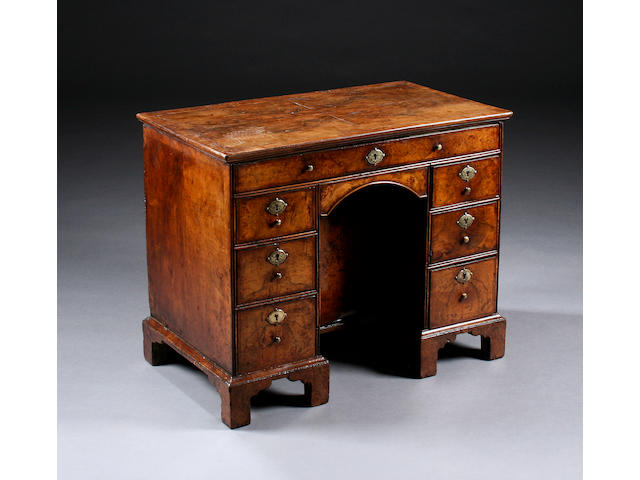 A fine early 18th century walnut kneehole desk of small proportions