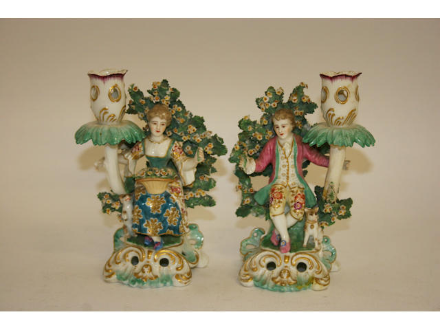 A pair of Samson figural candlesticks,