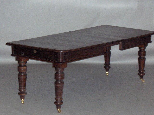 A Victorian teak and walnut campaign extending dining table,