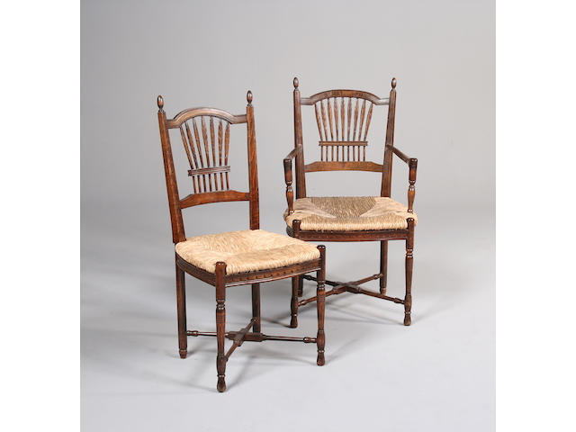 A Set of eight stained beech country dinning chairs
