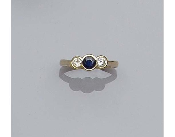 A 14ct gold diamond and sapphire three stone ring,