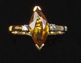 A yellow sapphire ring,