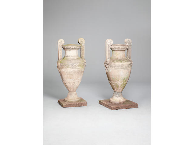 A pair of early 19th century Coad type imitation stone garden urns