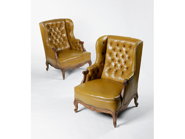 A pair of late 19th century carved oak library chairs