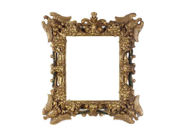 An Italian Late 17th Century carved, pierced and gilded frame with later additions