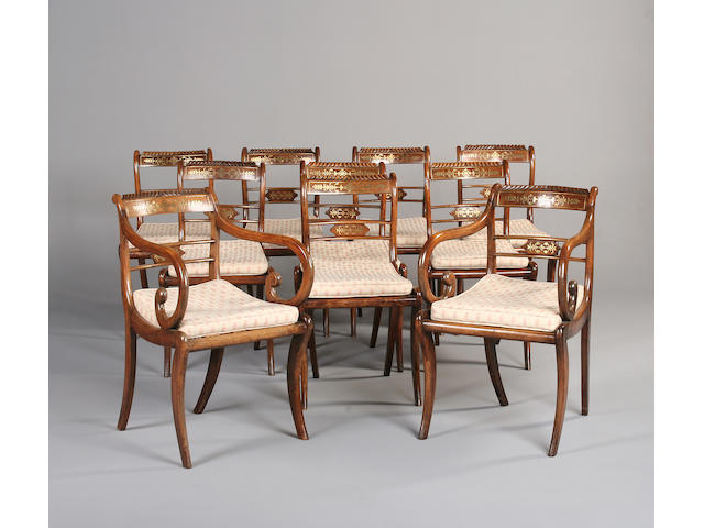 A set of ten faux rosewood and brass inlaid chairs