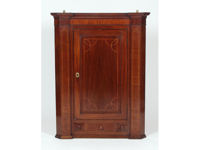 A Regency mahogany inverted breakfront hanging wall cupboard