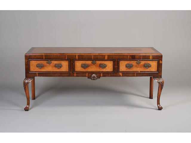 A George I style walnut and mahogany crossbanded sideboard