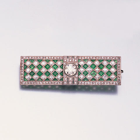 An art deco emerald and diamond plaque brooch,
