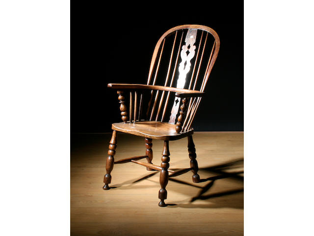 A 19th Century ashwood high back Windsor elbow chair