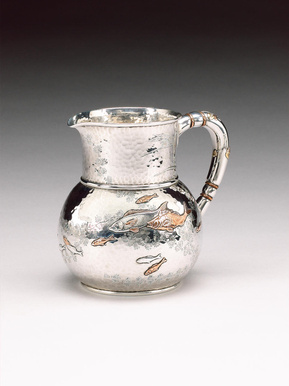 A late 19th century American silver and mixed metals pitcher, by Tiffany and Company, New York, circ