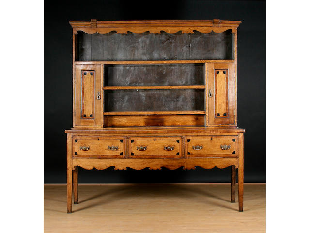 A George III oak and mahogany high dresser,