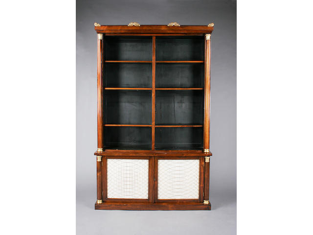A George IV rosewood and parcel gilt bookcase