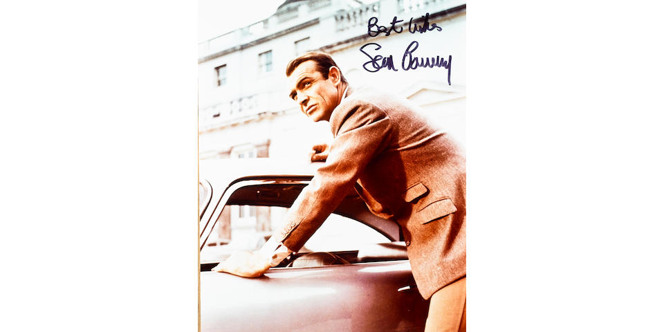 Three signed Sean Connery and Aston Martin DB5 photographs,