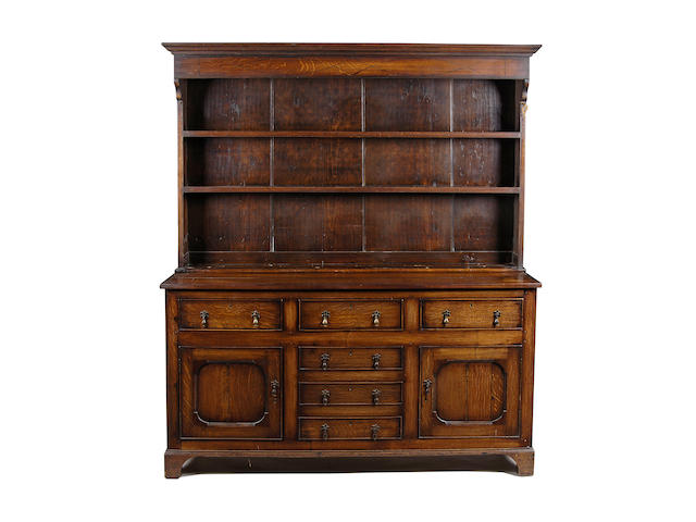 An early 19th century oak high dresser,