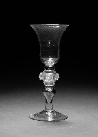 An important baluster coin wine glass circa 1740
