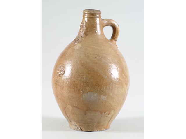 An early 18th Century German stoneware Bellarmine jug