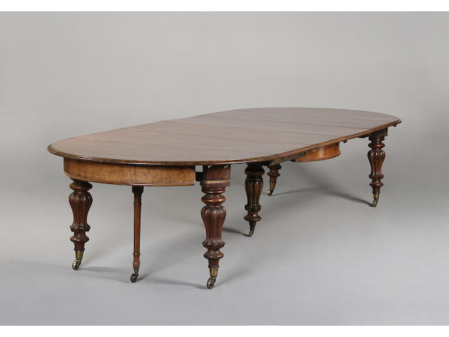 A large early Victorian pollard oak extending dining table