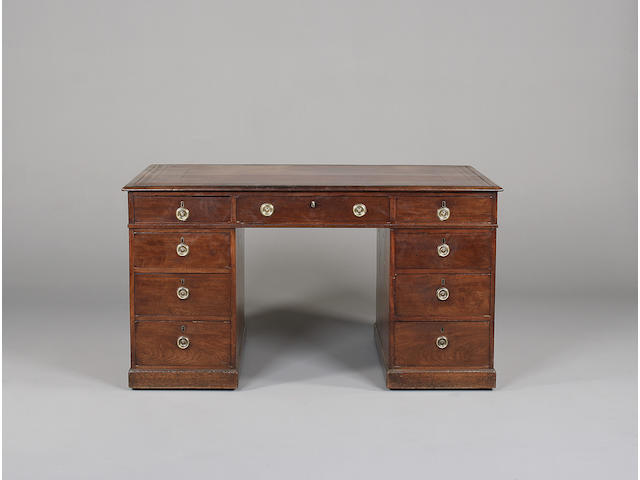 A small late George III mahogany partner's desk