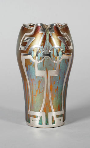 A Loetz iridescent glass vase with metal overlay