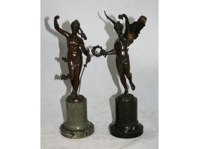 A pair of late 19th Century Continental patinated bronze figures,