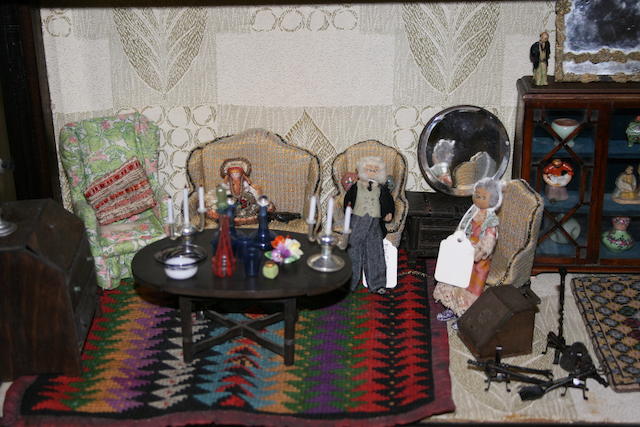 A collection of dolls house furniture and miniature dolls. a lot