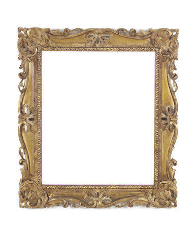 An English 18th Century carved, pierced and gilded Chippendale style frame