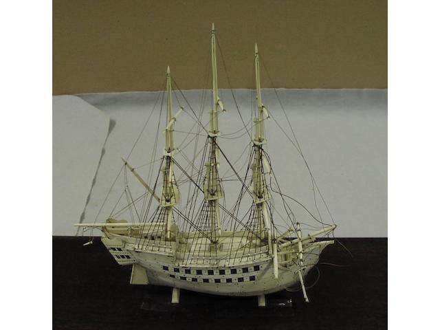 An ivory model of a three masted ship, 60 x 24 x 38cm.