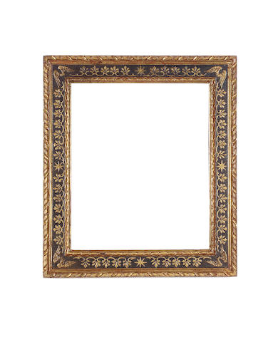 A Spanish 16th Century parcel-gilt and black painted cassetta frame