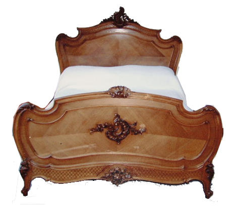 A 20th century French  walnut double bedstead,