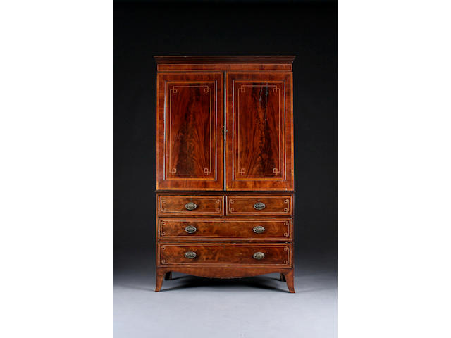 An early 19th century gentleman's two-stage inlaid mahogany press cupboard