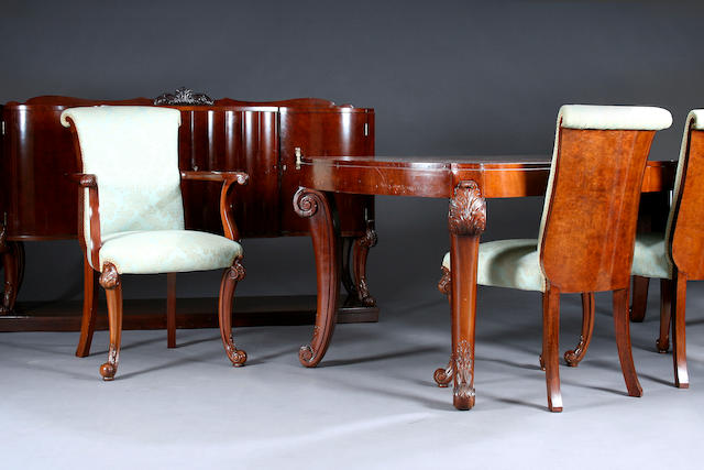 A late 1920s/early 1930s walnut ten-piece dining suite attributed to Harry and Lou Epstein