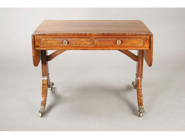 A Regency figured mahogany and brass line inlaid sofa table