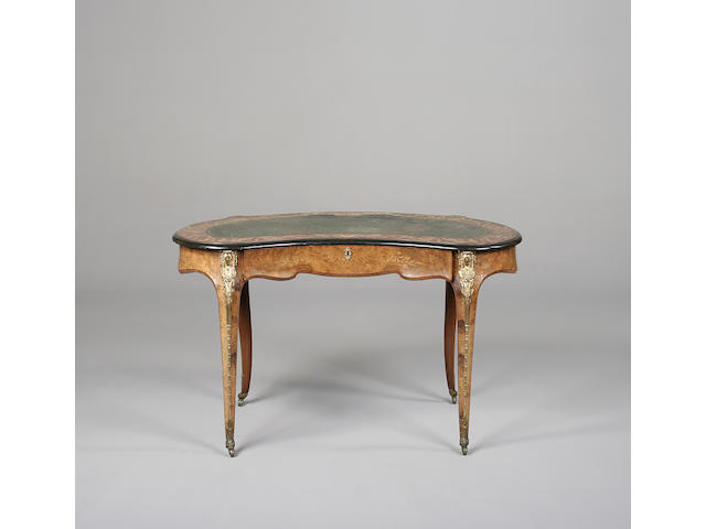A Victorian walnut, marquetry and gilt metal mounted kidney shaped desk